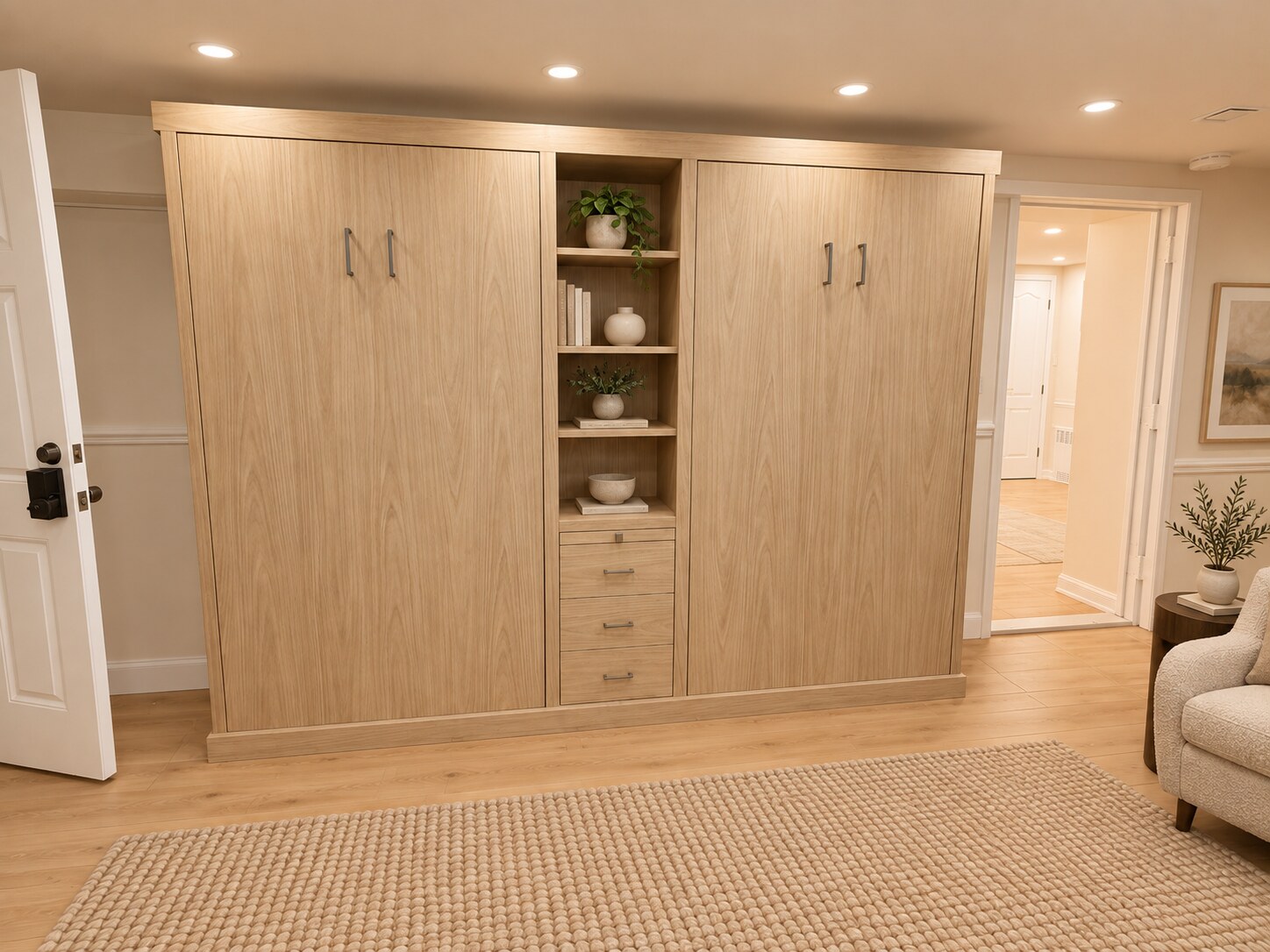 Two closed twin Murphy beds in natural wood cabinetry with center shelving and drawers
